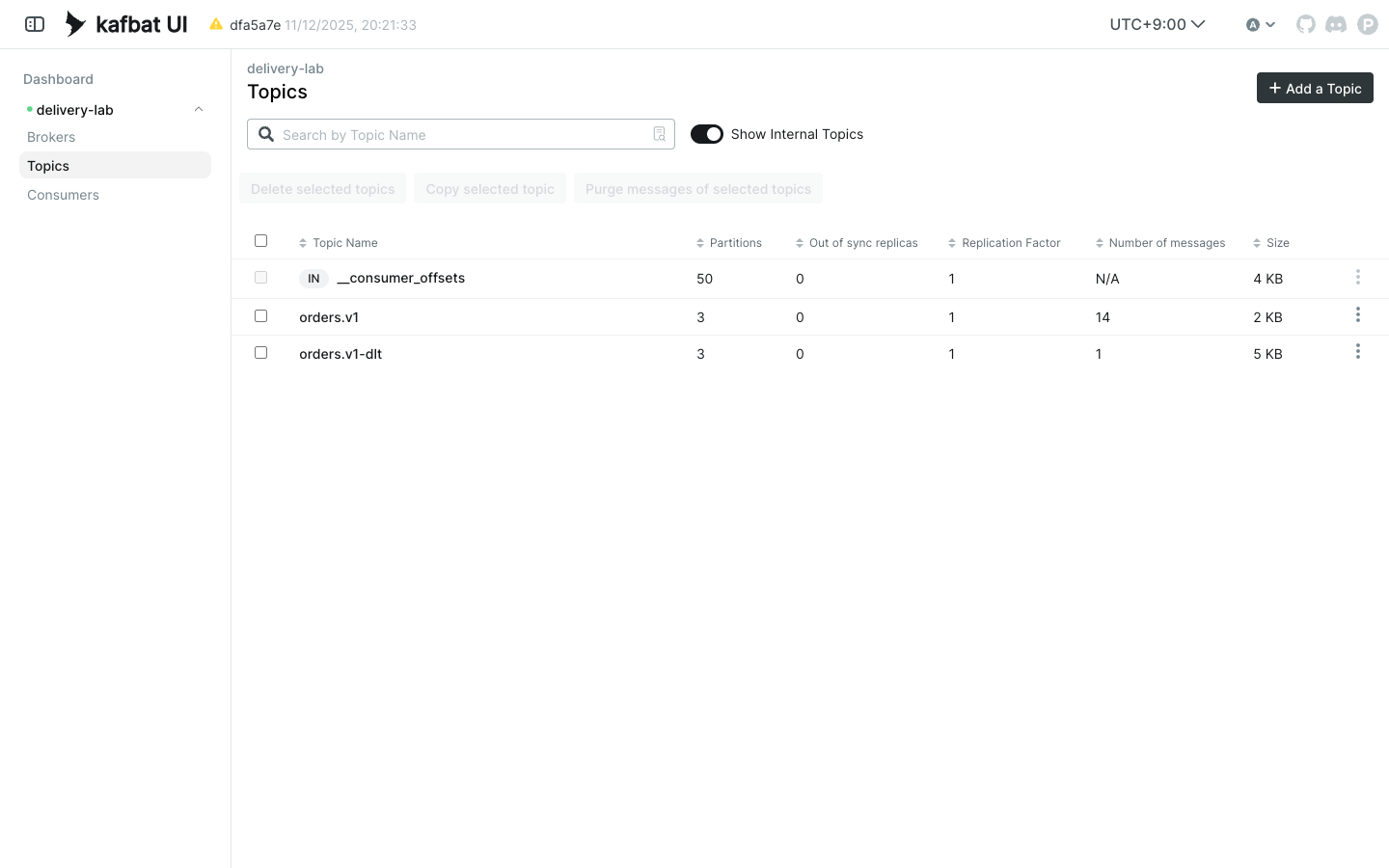 Kafbat UI showing the measured orders.v1 topic with 14 records and orders.v1-dlt with one poison record